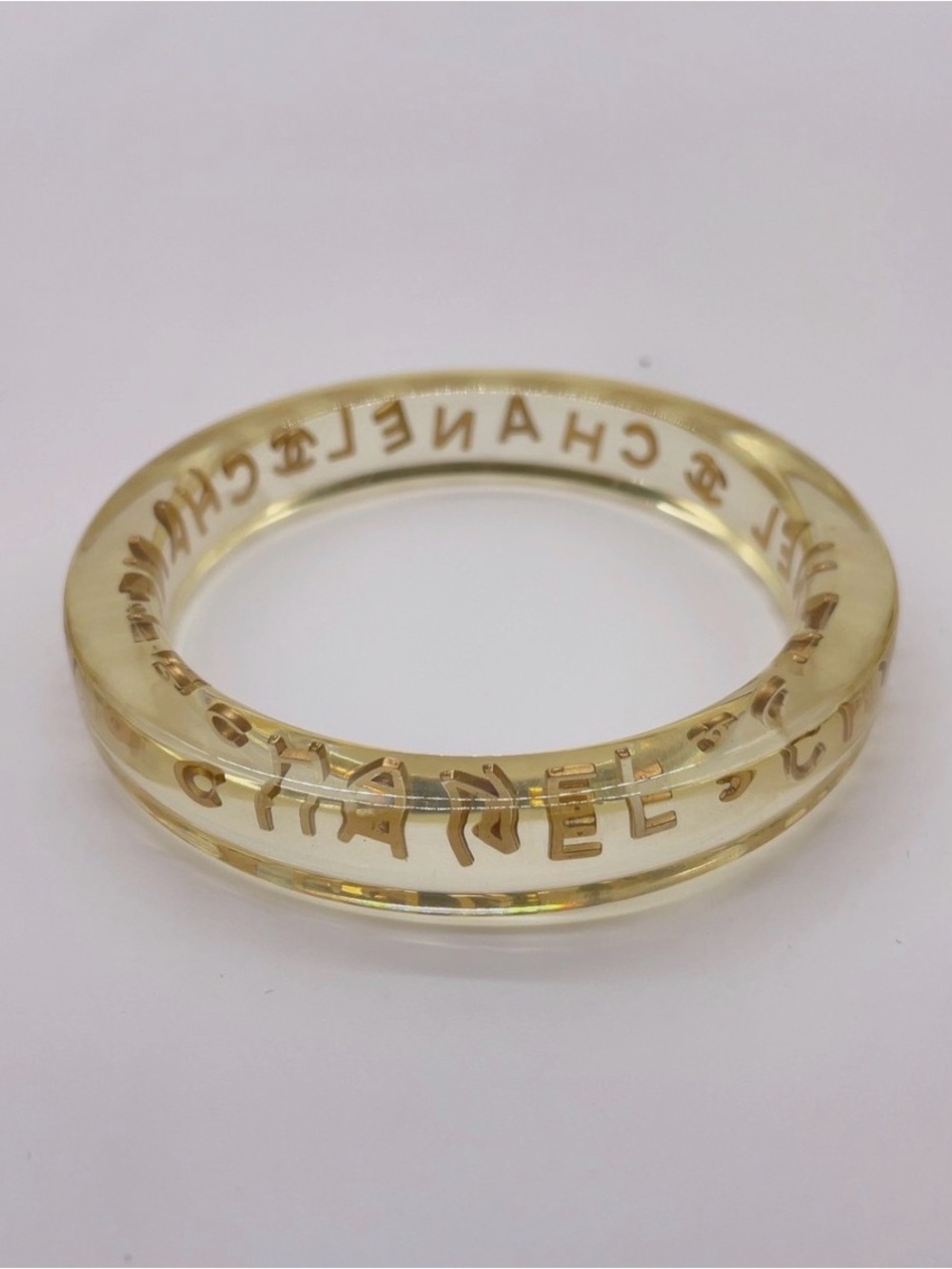 CHANEL LUCITE & Gold Letter Clear Acrylic Bangle - Picture 12 of 12